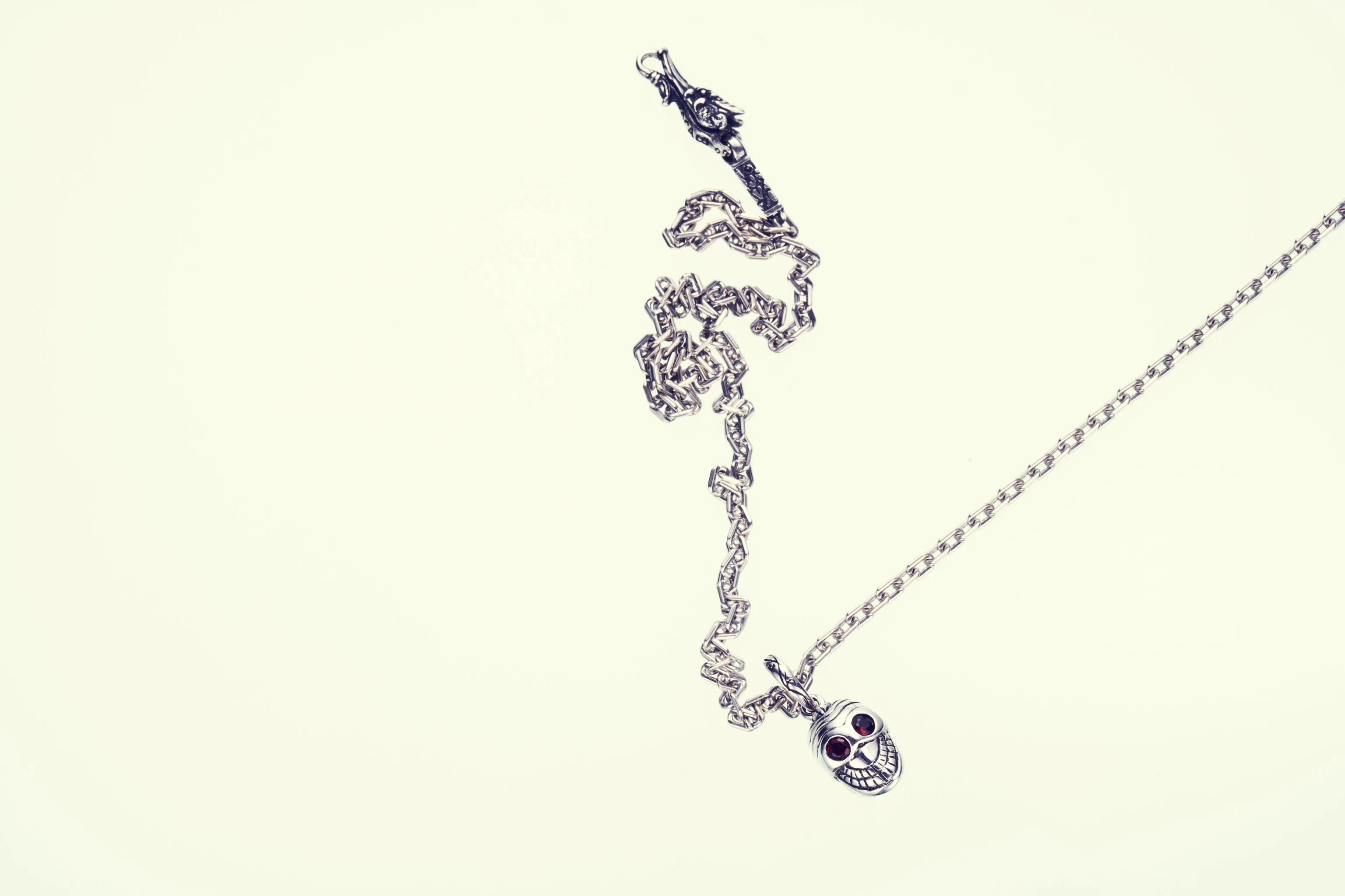 Jeweled Tibetan Smile Skull Charm : (Garnet CZ)